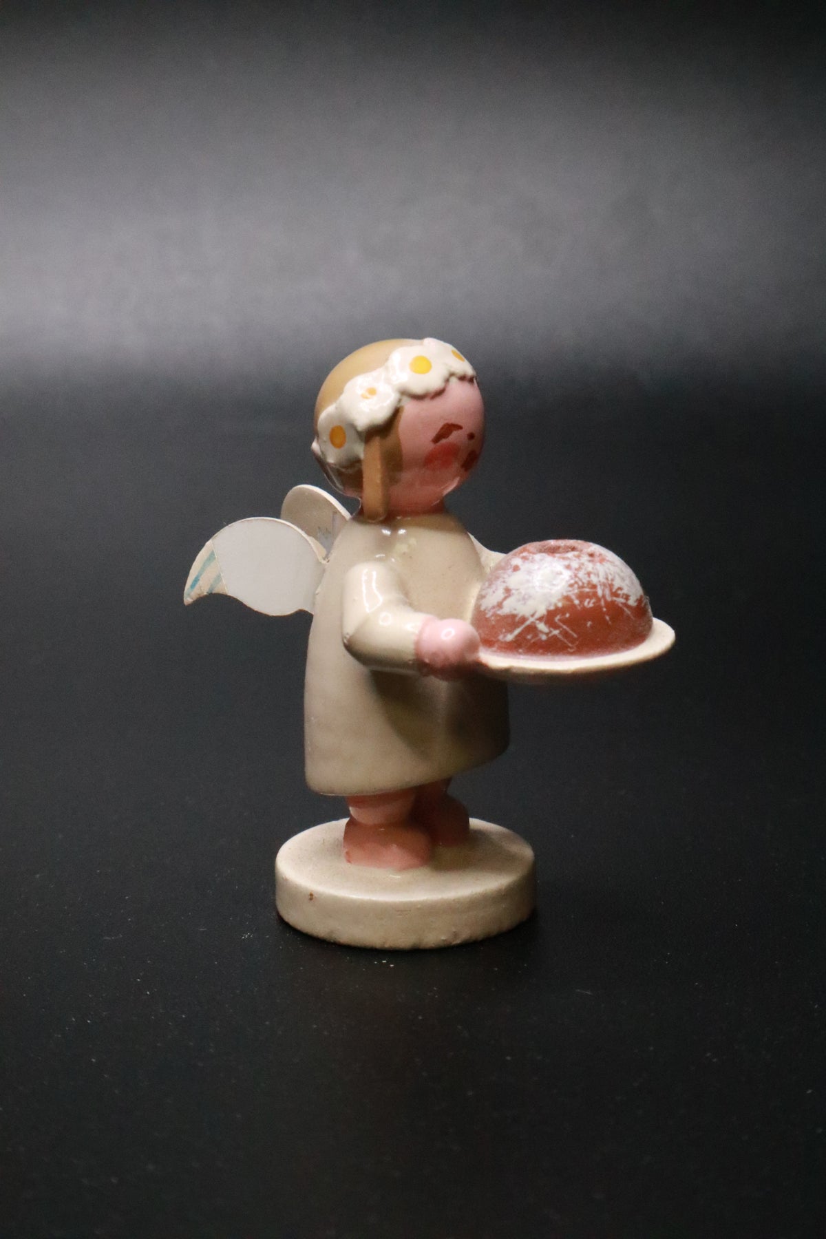 WENDT AND KüHN GERMAN "MARGUERITE ANGEL" FIGURINE "HOLDING A BUNT CAKE"