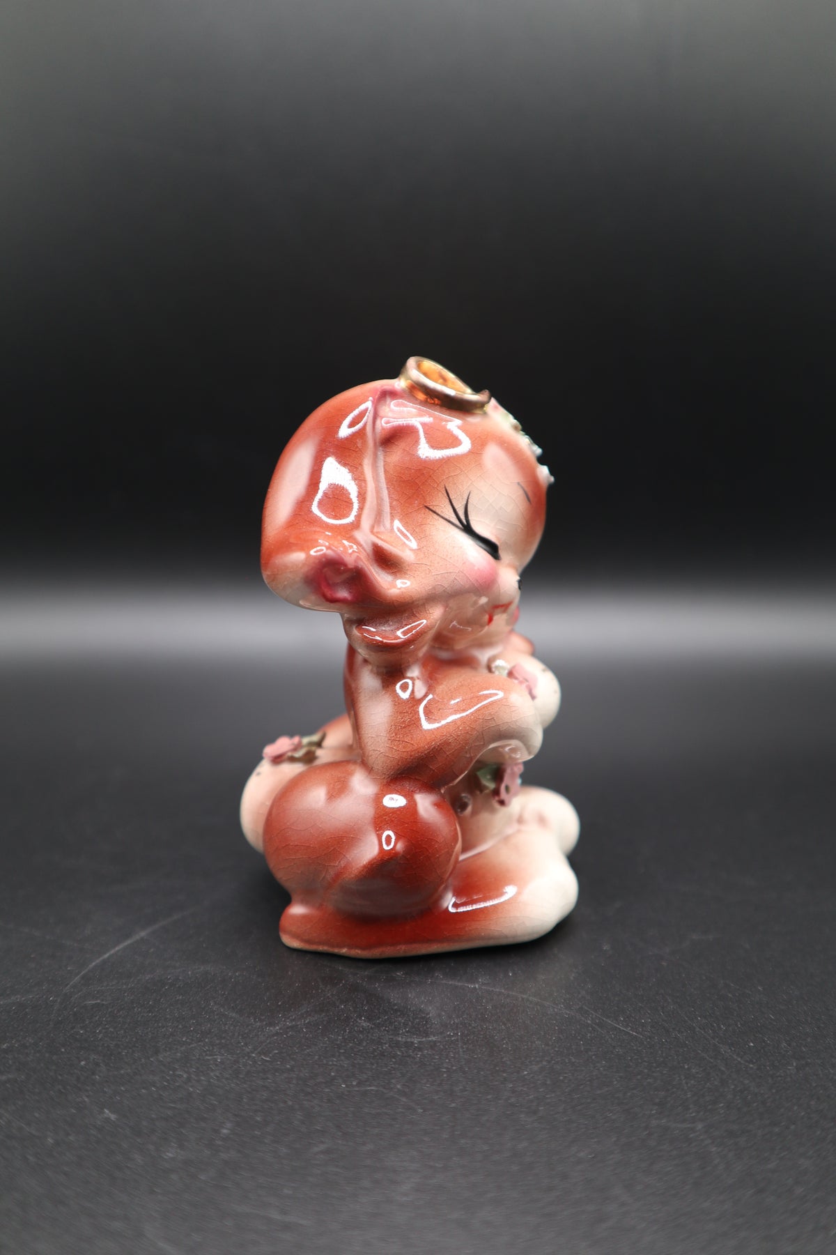 SMALL CERAMIC DOG WITH FLOWERS AND GOLD BOW