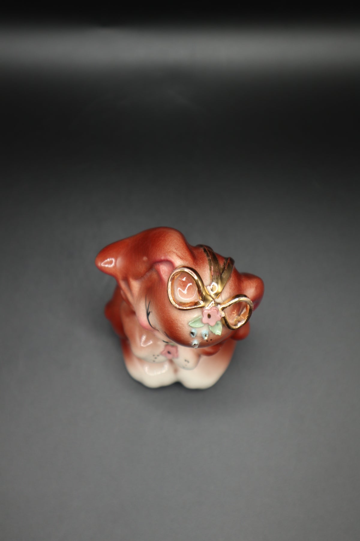 SMALL CERAMIC DOG WITH FLOWERS AND GOLD BOW