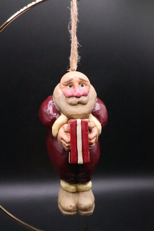 CHRISTMAS SANTA HOLDING GIFT ORNAMENT