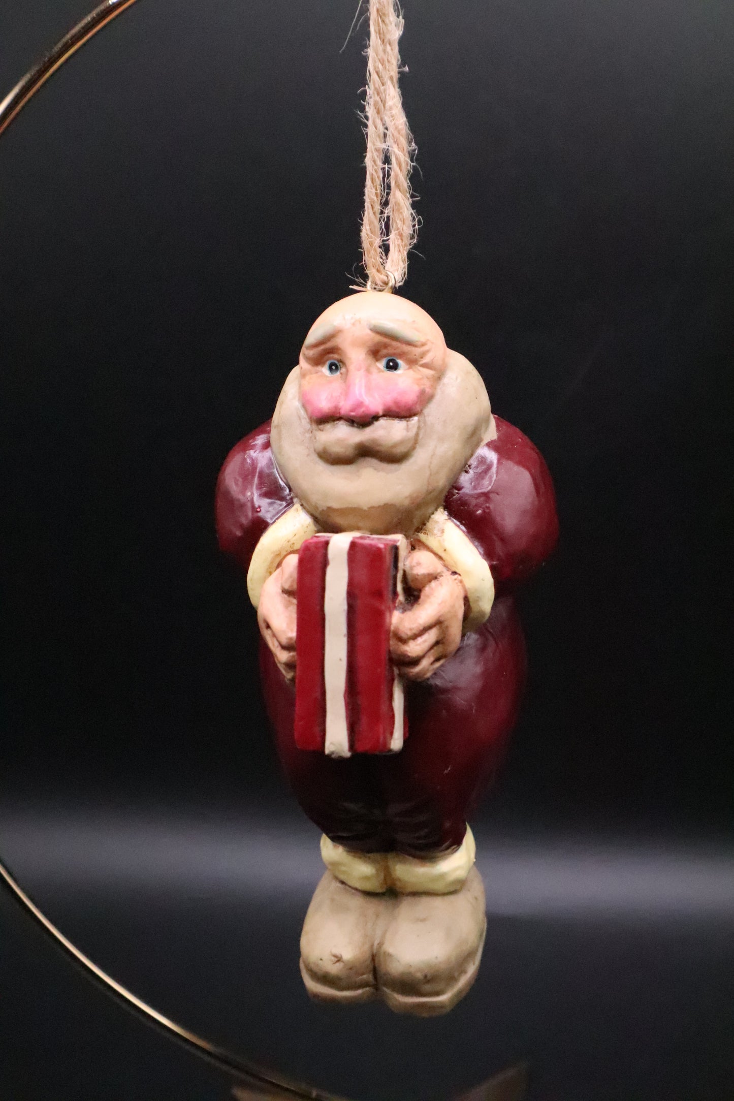 CHRISTMAS SANTA HOLDING GIFT ORNAMENT