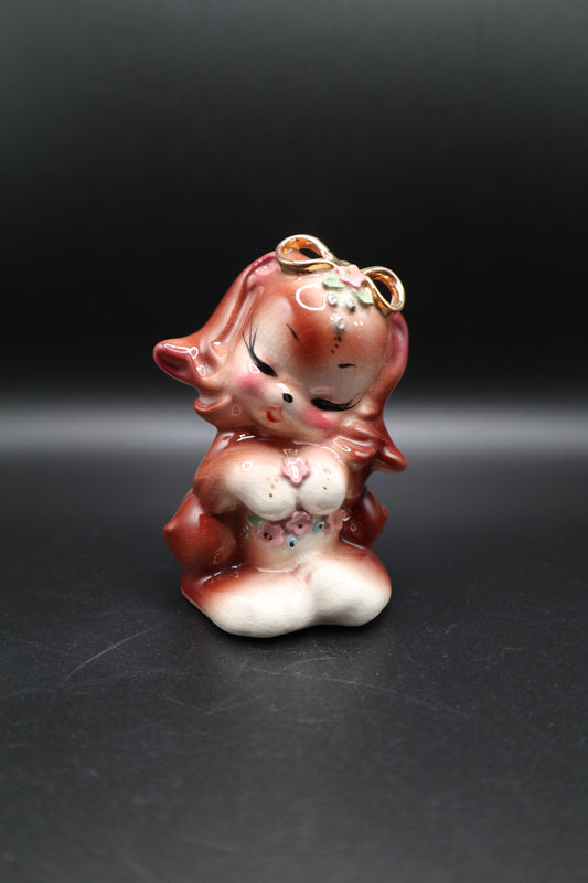 SMALL CERAMIC DOG WITH FLOWERS AND GOLD BOW