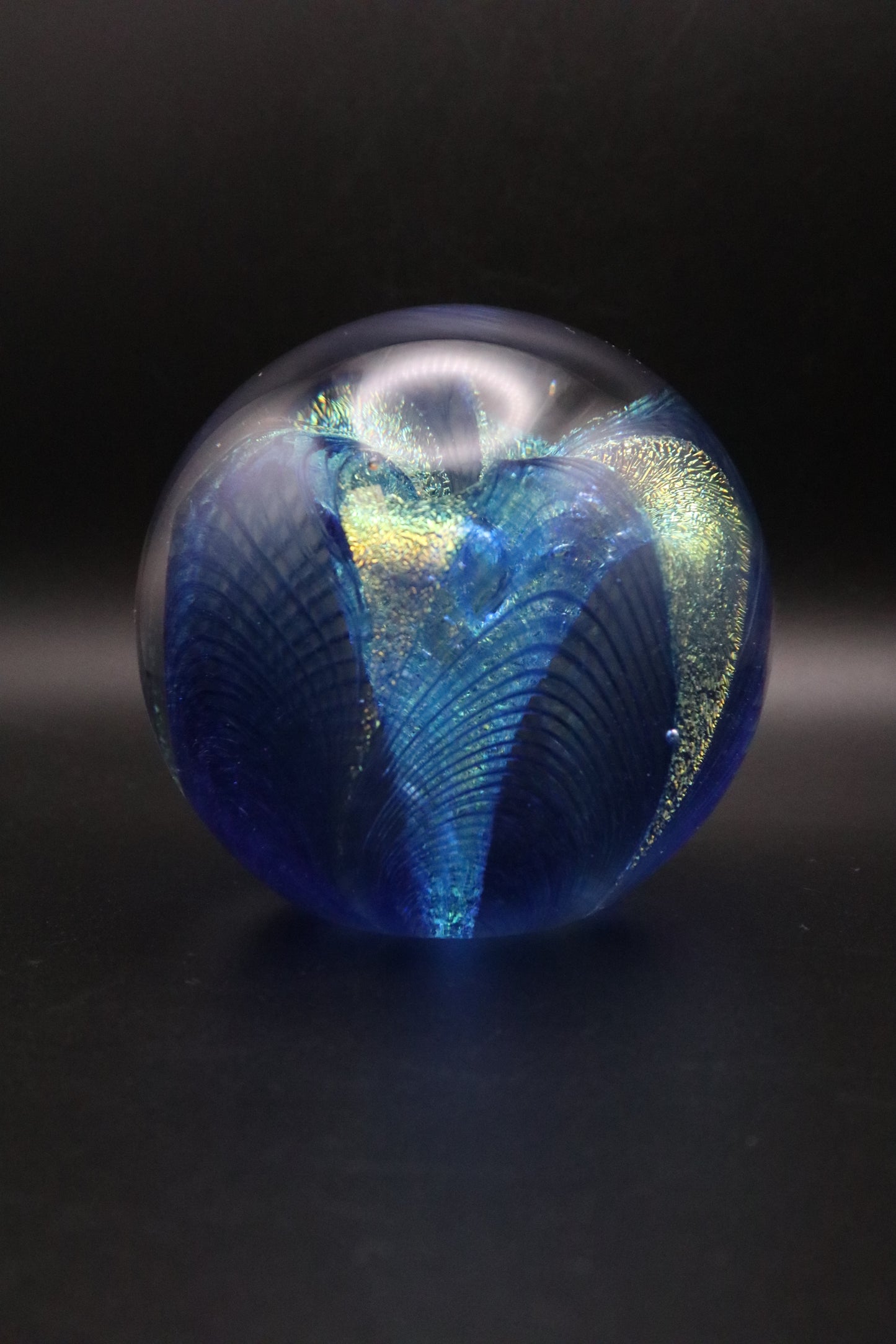 GLASS EYE STUDIO HAND BLOWN METALLIC BLUE WITH GOLD FLOWER PAPERWEIGHT