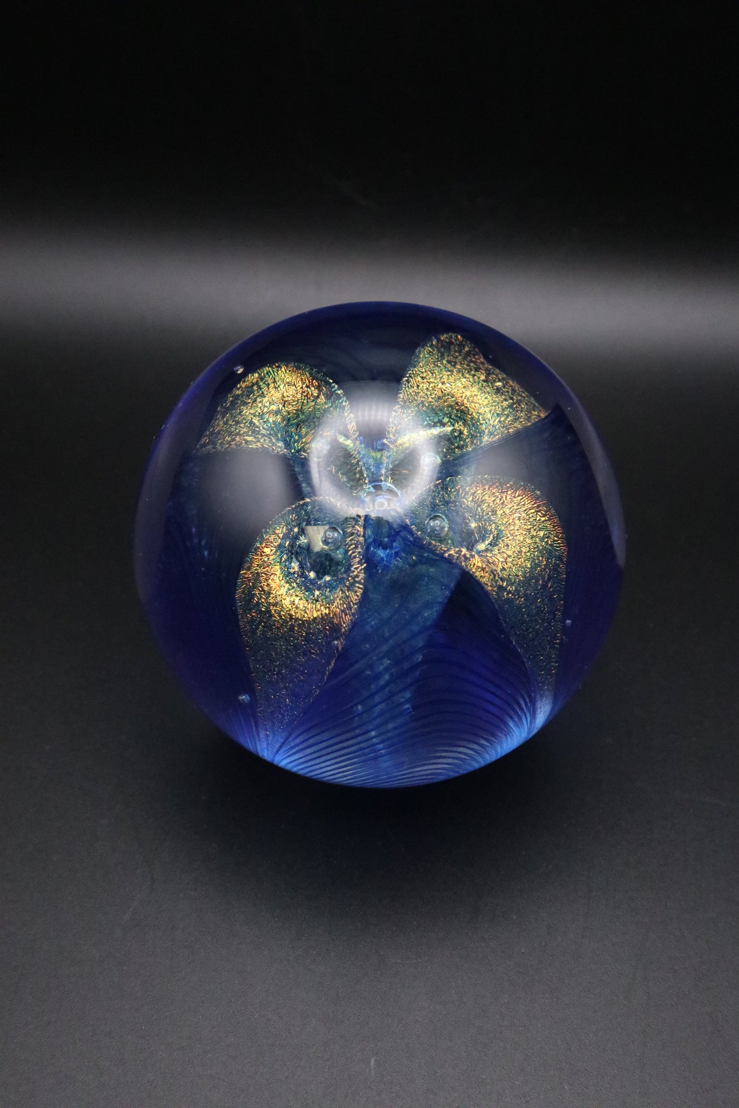 GLASS EYE STUDIO HAND BLOWN METALLIC BLUE WITH GOLD FLOWER PAPERWEIGHT